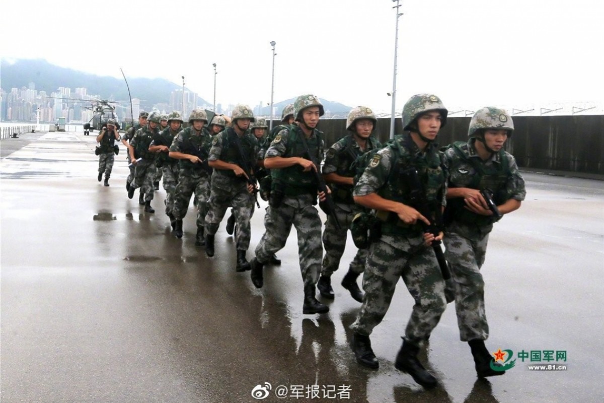 Troops from the Peopleâs Liberation Army in an exercise alongside Victoria Harbour, on the 150m strip of Hong Kong land that became PLA property last month. Photo: Weibo